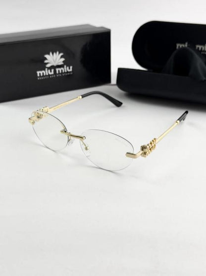 MIU MIU gold frame 1025