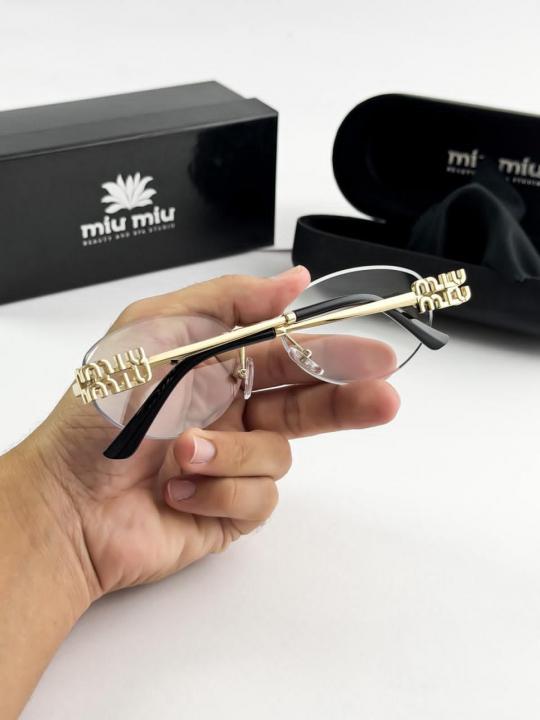 MIU MIU gold frame 1025